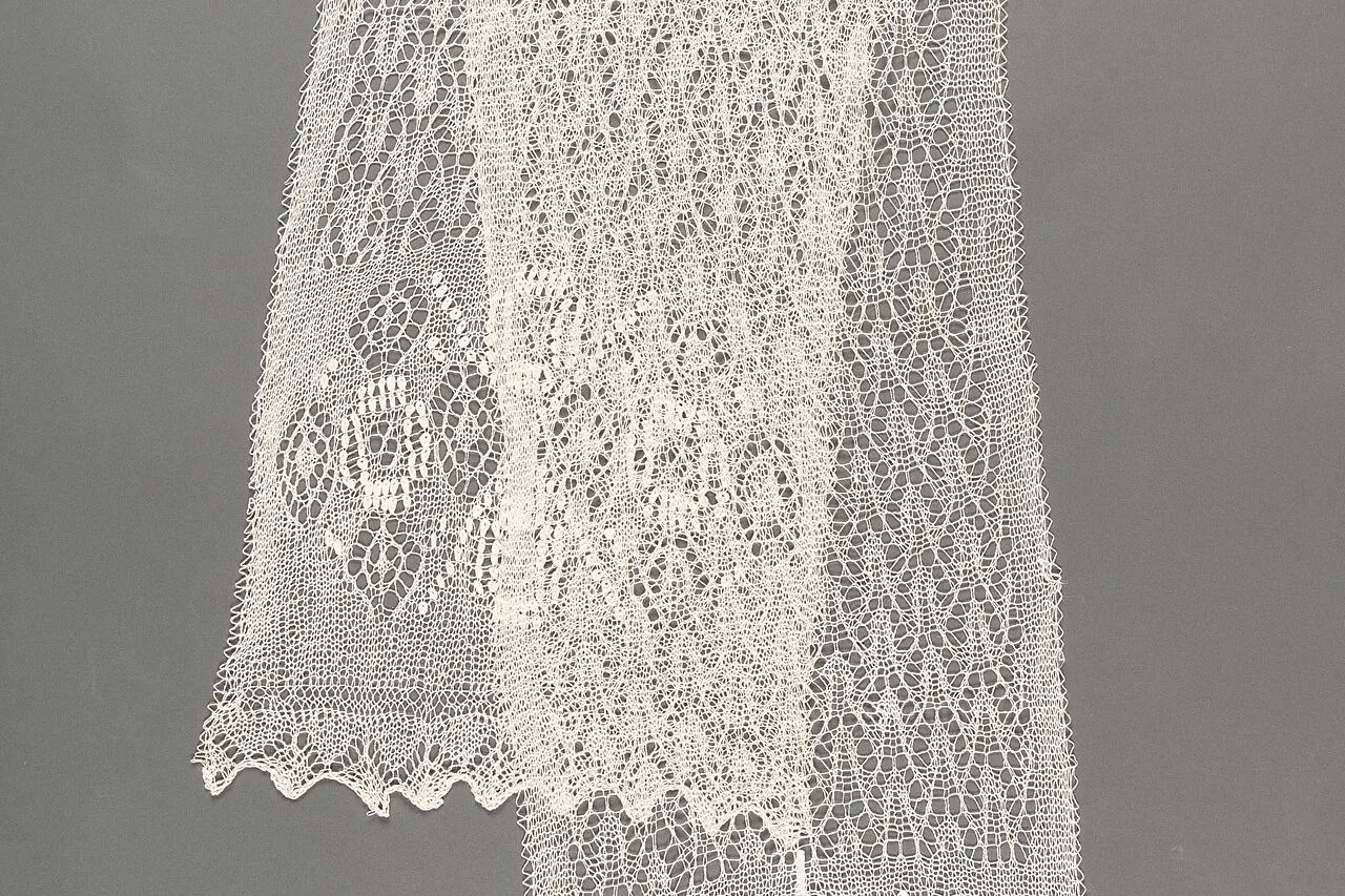 Hand-knitted Haapsalu lace shawl with a traditional lace pattern and pointed edge