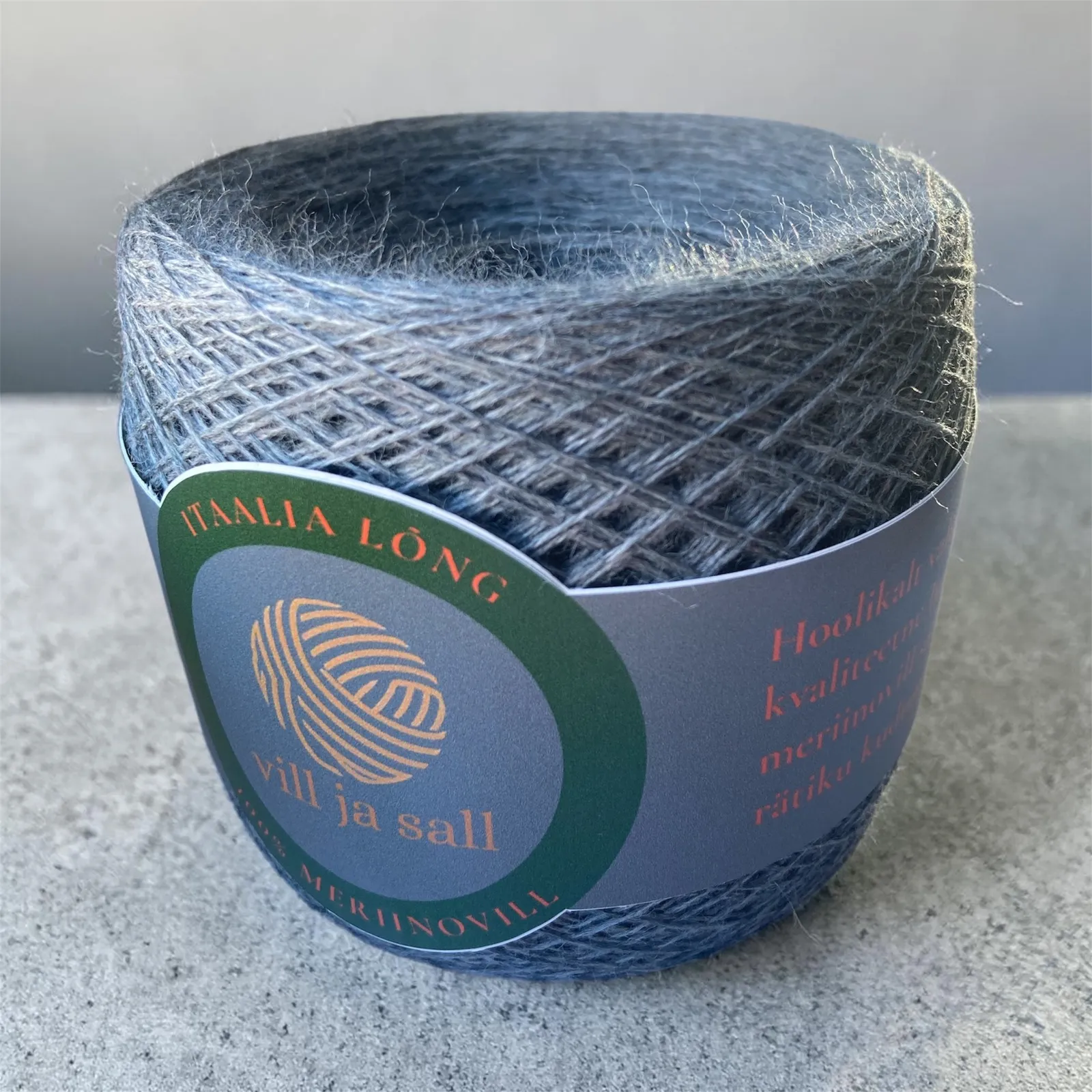 M11, dark grey, a ball of merino wool yarn