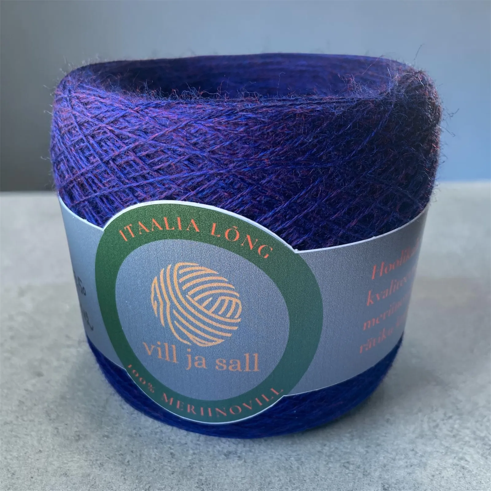 M12, indigo blue, a ball of merino wool yarn